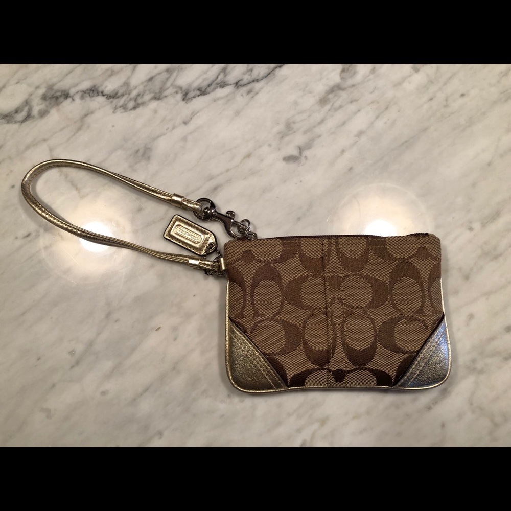 Small coach wristlet with gold accents